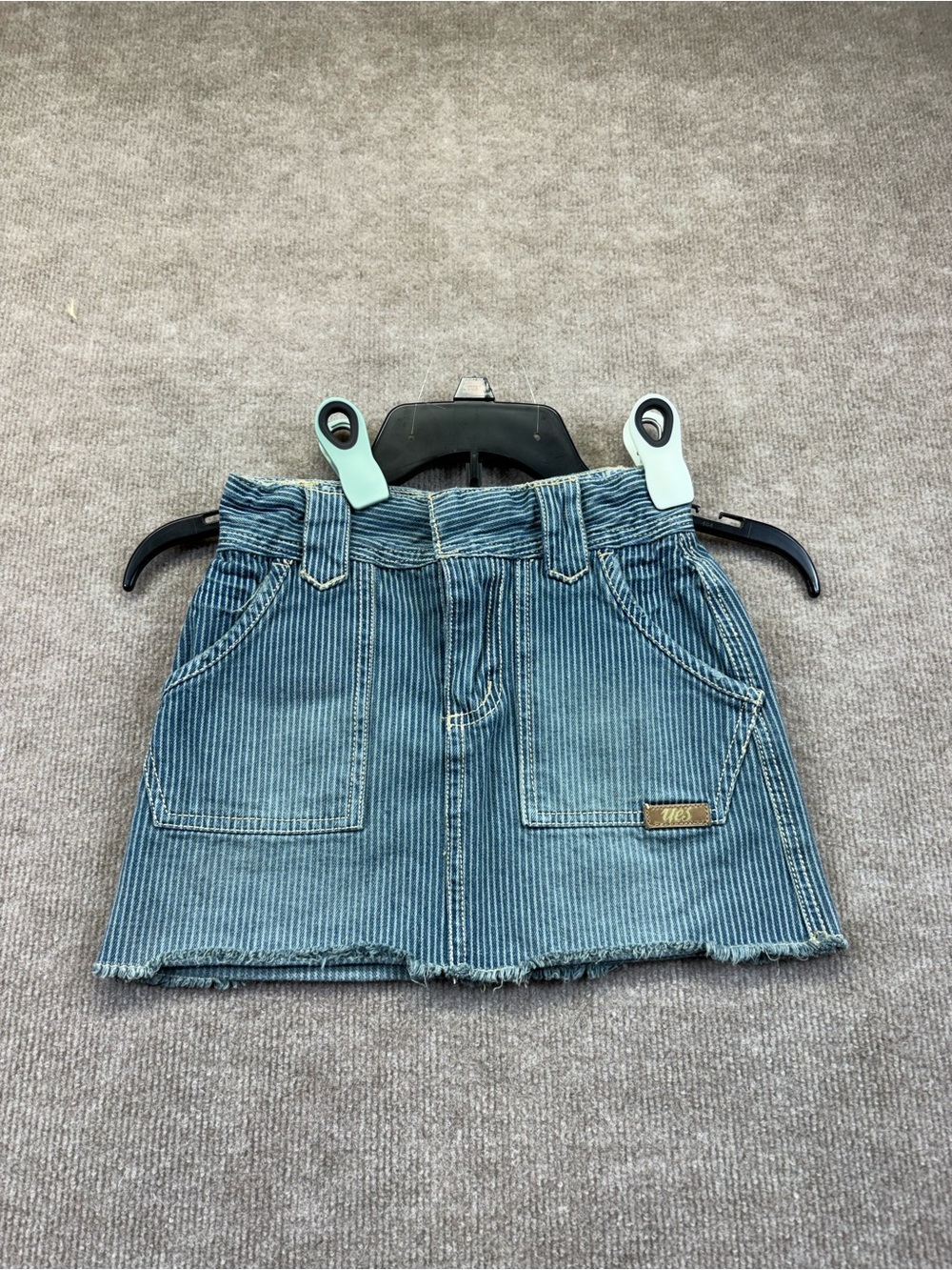 vintage Y2K Yes. brand denim skirt features a blue and white pinstripe pattern,